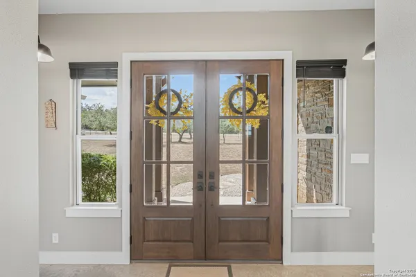a view of an entryway with front door