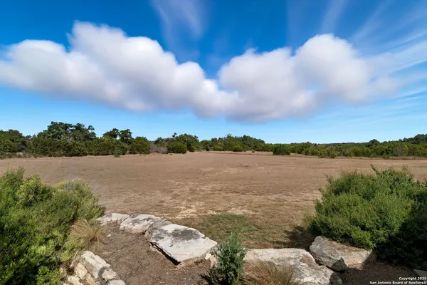 a view of lake with green space