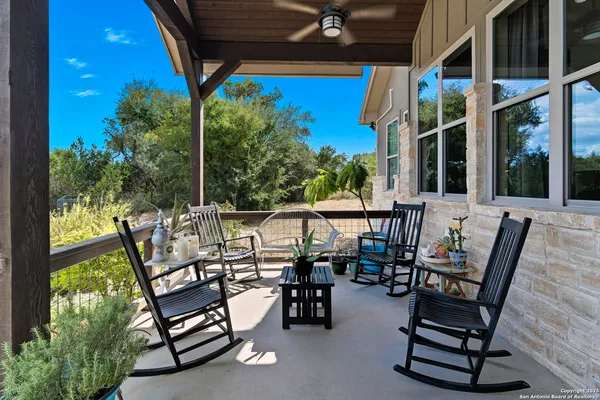 a view of an chairs and table in the patio