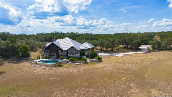 a front view of a house with a big yard