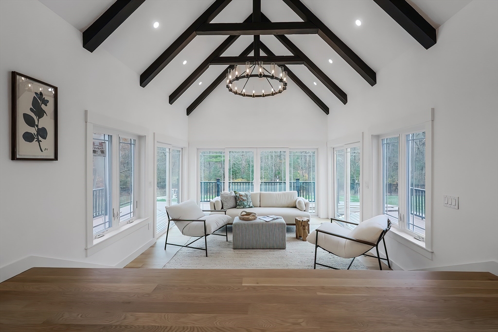 54 Spywood Road Sherborn, MA 01770 - Photo 17 of 42 a living room with furniture a window and a ceiling fan