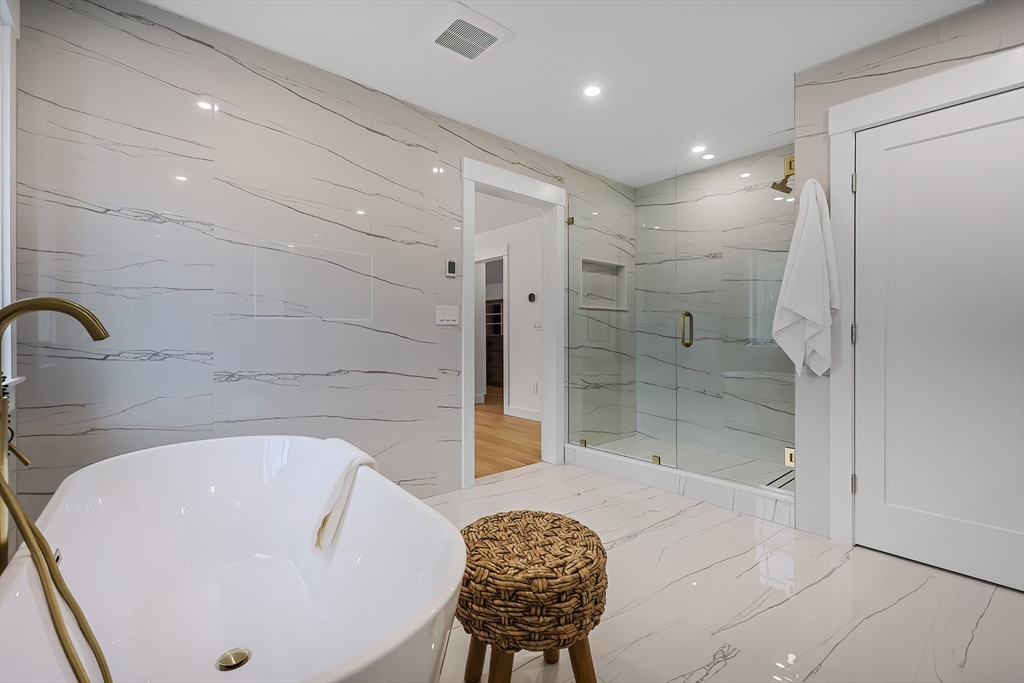 54 Spywood Road Sherborn, MA 01770 - Photo 25 of 42 a bathroom with a bathtub and a shower