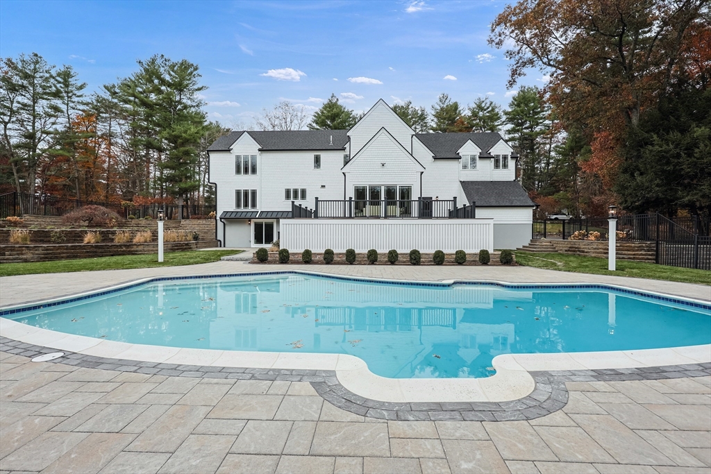54 Spywood Road Sherborn, MA 01770 - Photo 37 of 42 a view of a house with a swimming pool and a yard