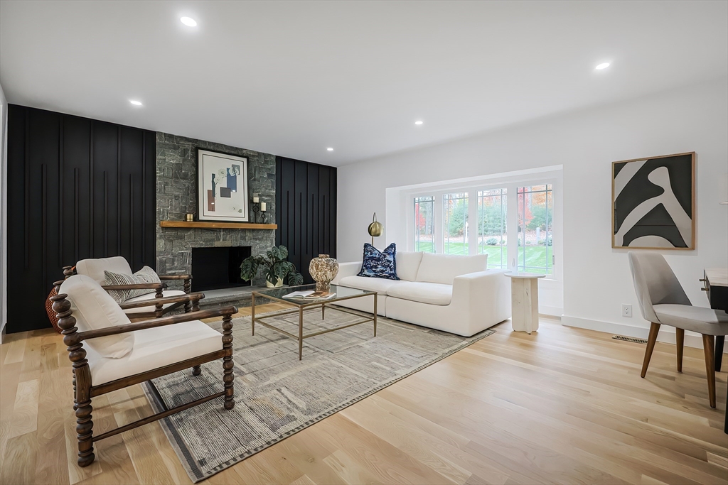 54 Spywood Road Sherborn, MA 01770 - Photo 6 of 42 a living room with furniture a rug and a fireplace