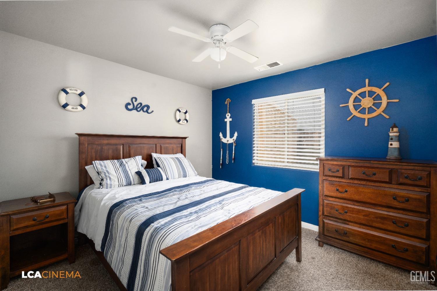 Undisclosed Address Bakersfield, CA 93312 - Photo 15 of 38 a bedroom with a bed and a chandelier