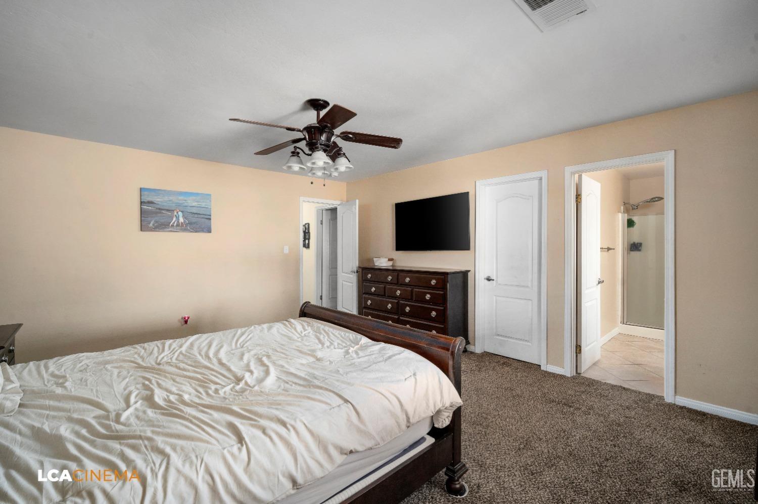 Undisclosed Address Bakersfield, CA 93312 - Photo 18 of 38 a bedroom with a bed and a flat screen tv