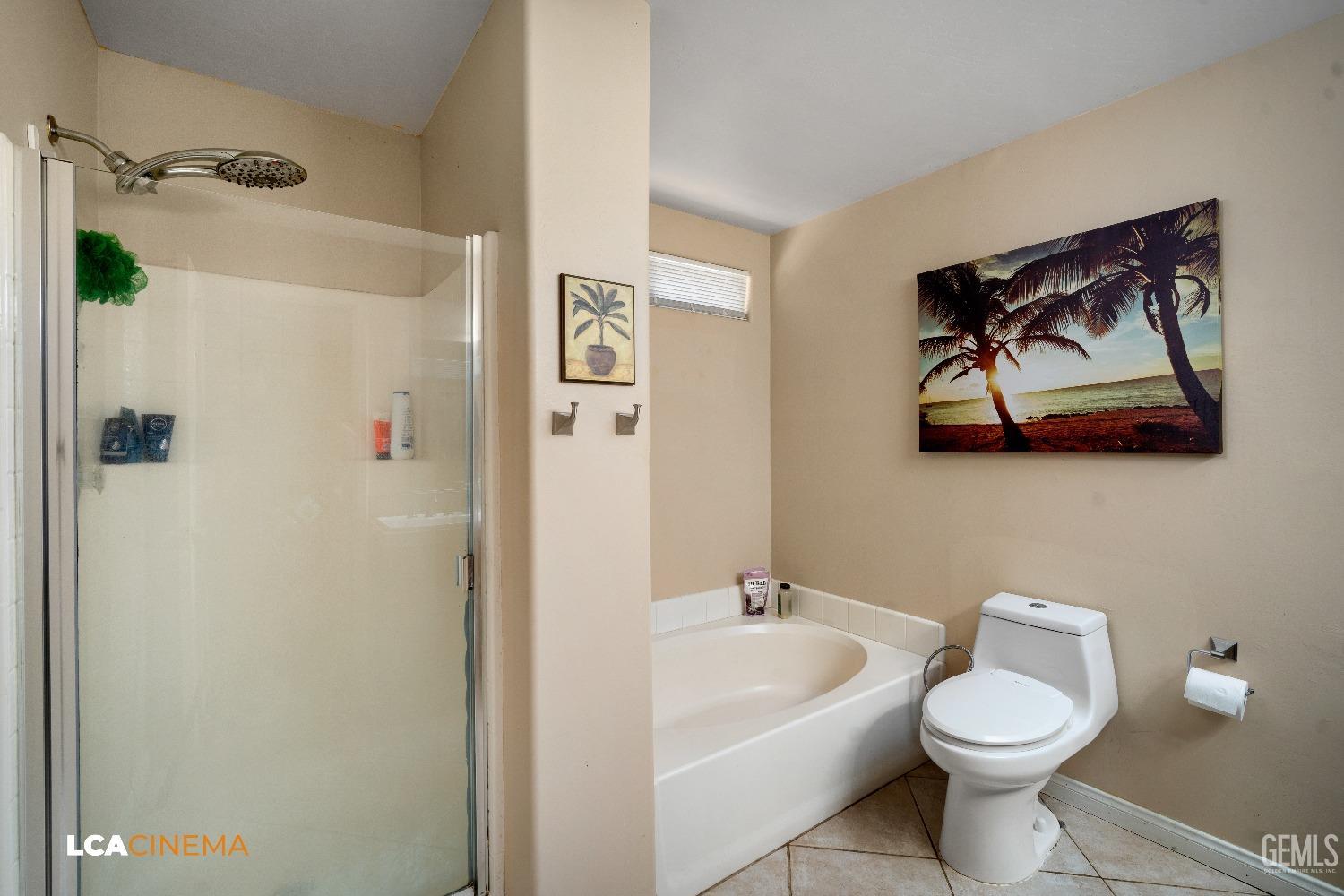 Undisclosed Address Bakersfield, CA 93312 - Photo 19 of 38 a white toilet sitting next to a bathroom sink and tub