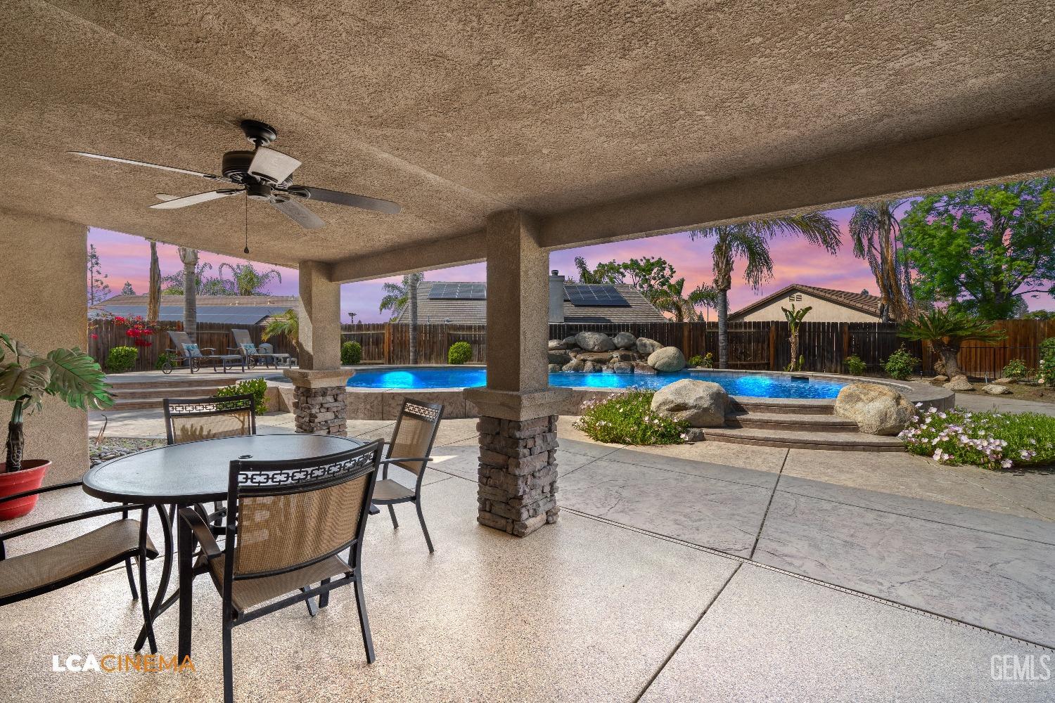 Undisclosed Address Bakersfield, CA 93312 - Photo 22 of 38 a view of a patio with a table and chairs and potted plants