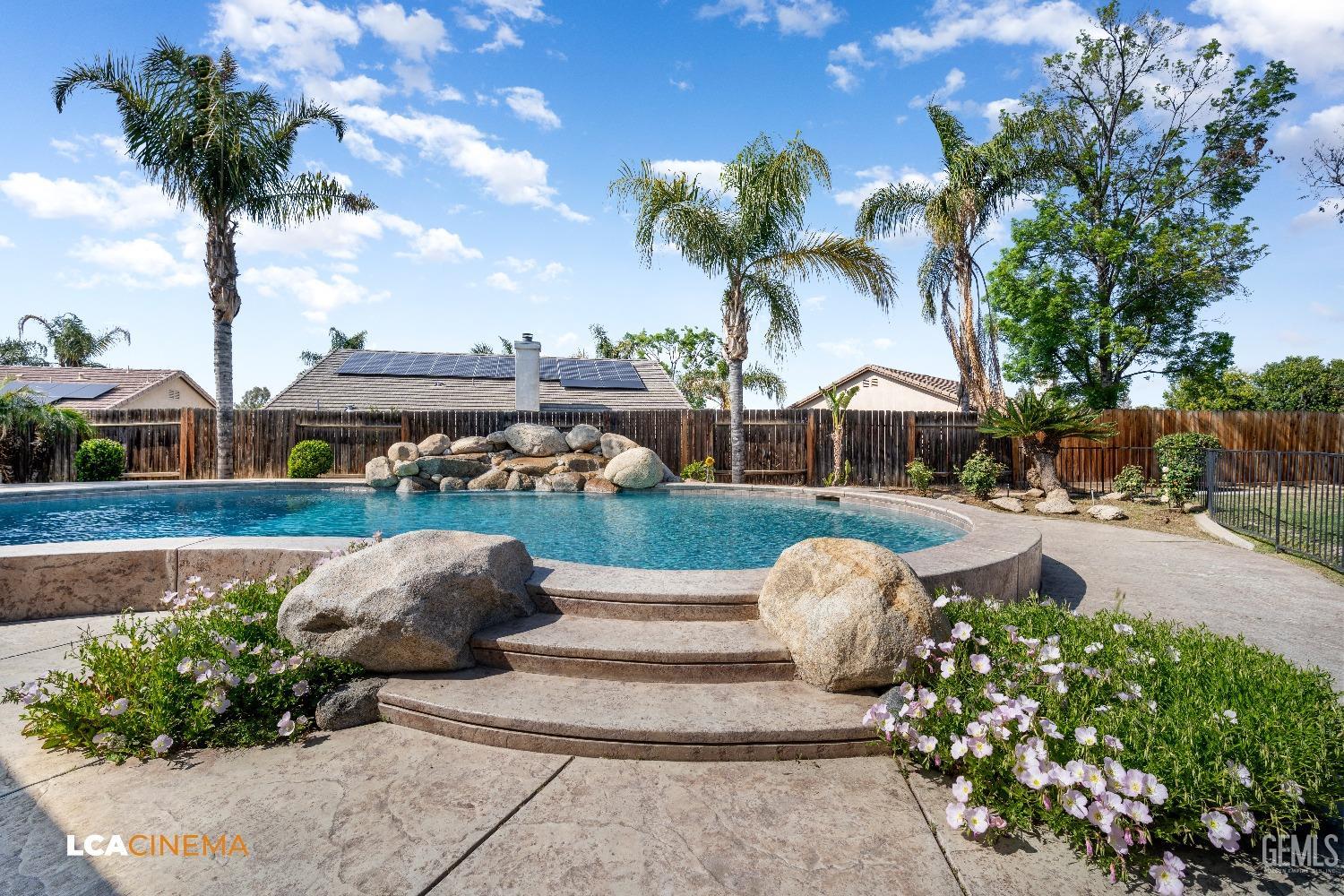 Undisclosed Address Bakersfield, CA 93312 - Photo 23 of 38 a view of a garden with palm trees
