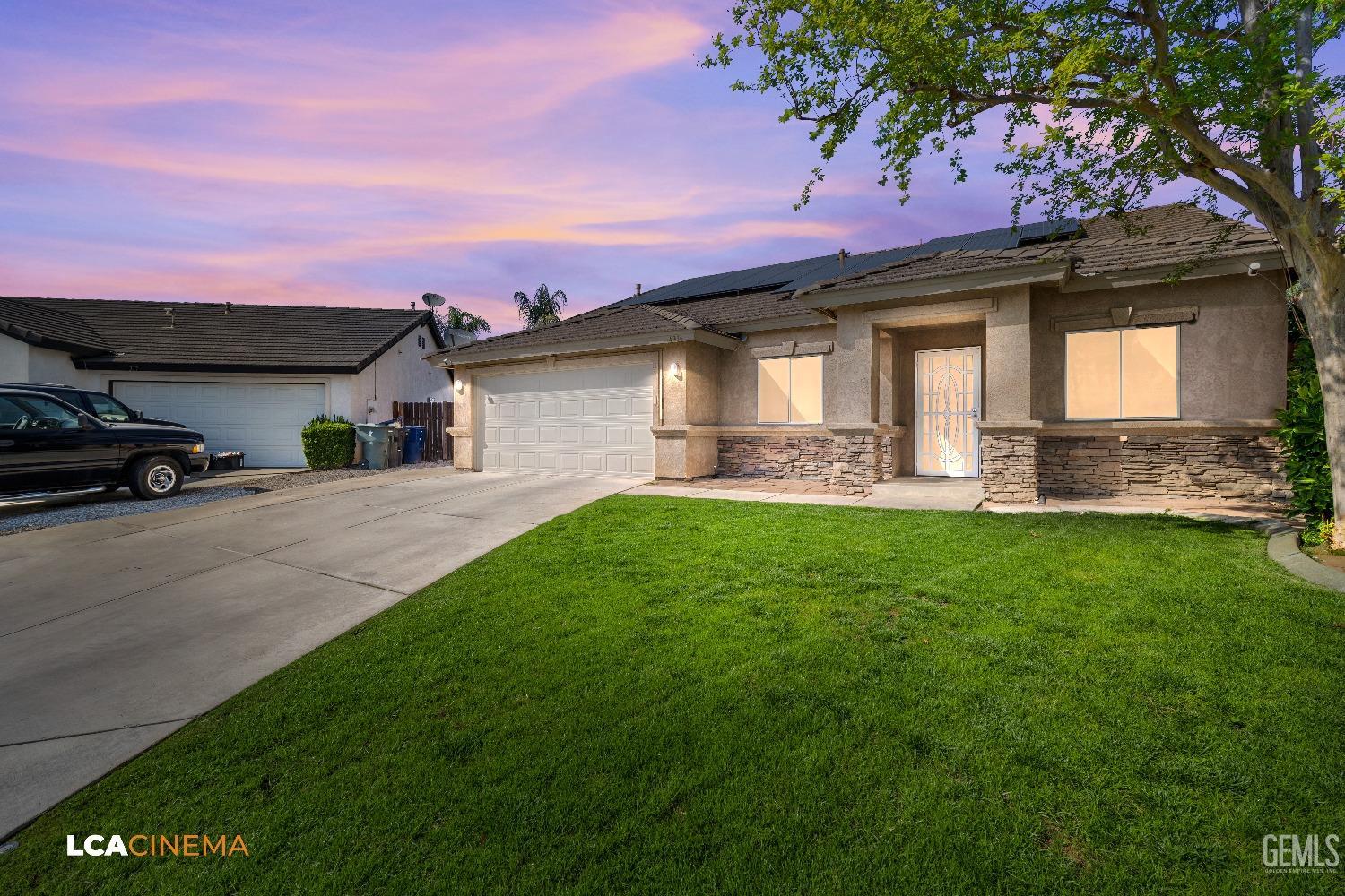 Undisclosed Address Bakersfield, CA 93312 - Photo 3 of 38 a front view of a house with a garden and yard