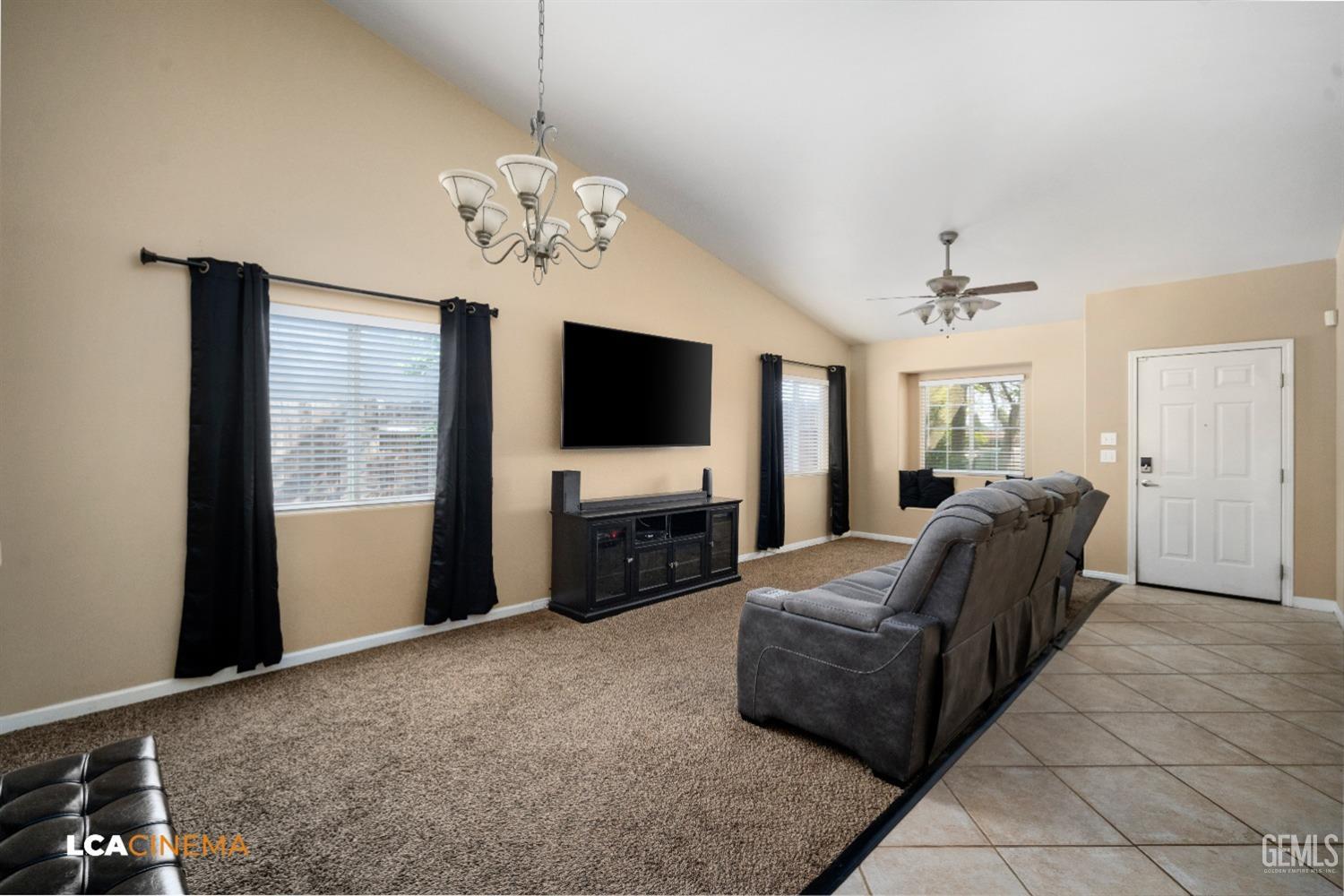 Undisclosed Address Bakersfield, CA 93312 - Photo 4 of 38 a living room with furniture and a flat screen tv