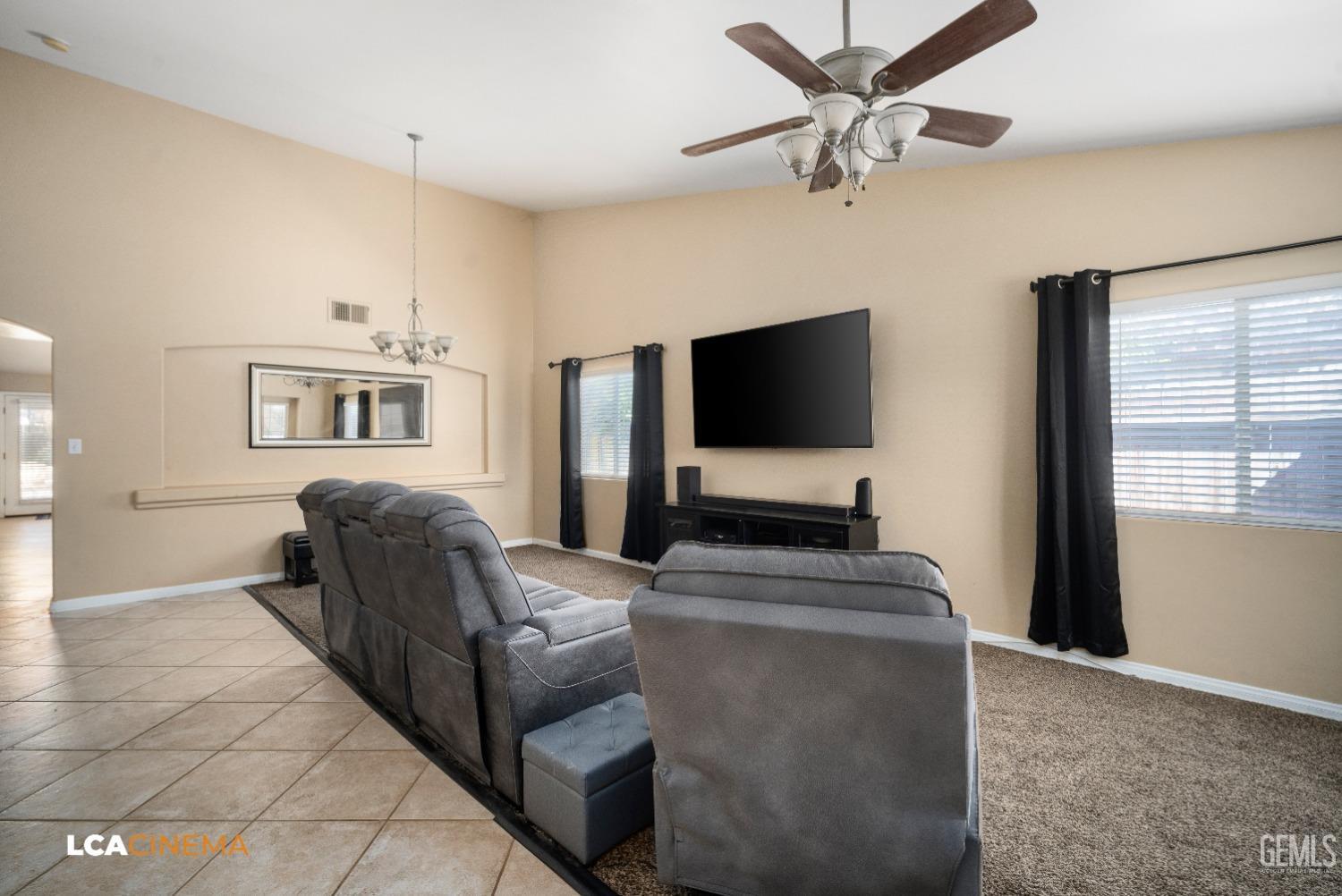 Undisclosed Address Bakersfield, CA 93312 - Photo 5 of 38 a living room with furniture and a flat screen tv