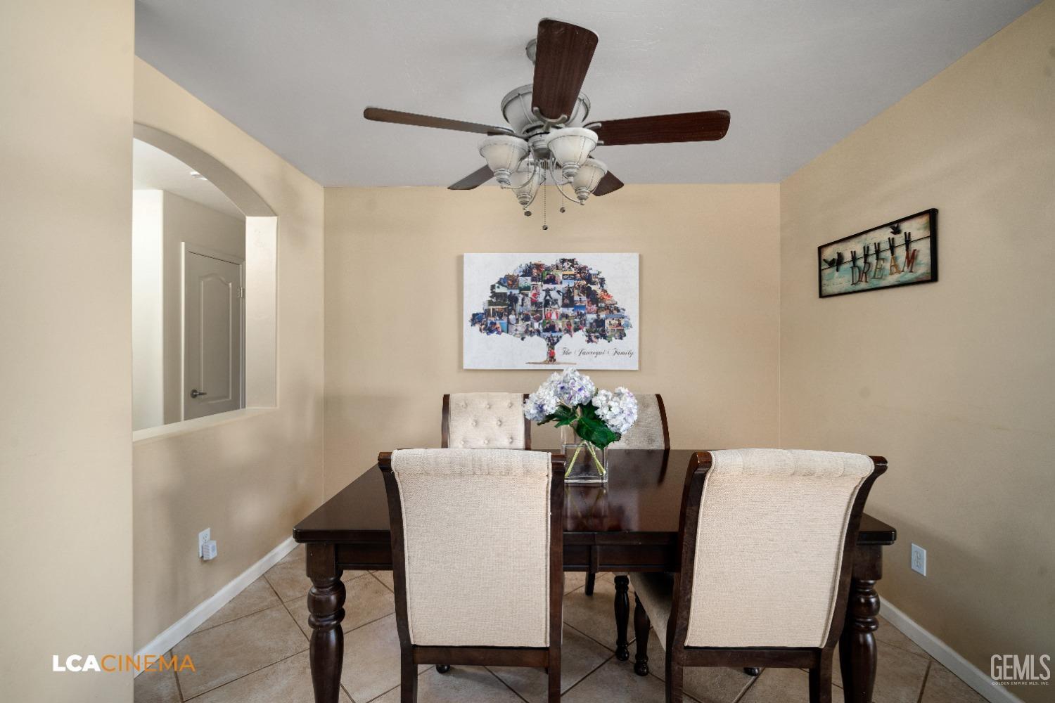 Undisclosed Address Bakersfield, CA 93312 - Photo 6 of 38 a view of a dining room with furniture and a chandelier fan
