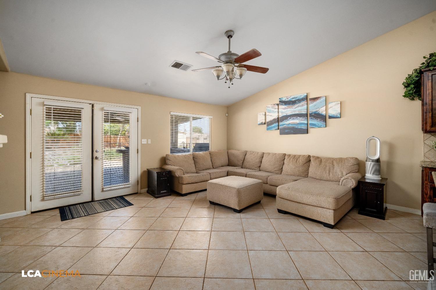 Undisclosed Address Bakersfield, CA 93312 - Photo 10 of 38 a living room with furniture and a flat screen tv