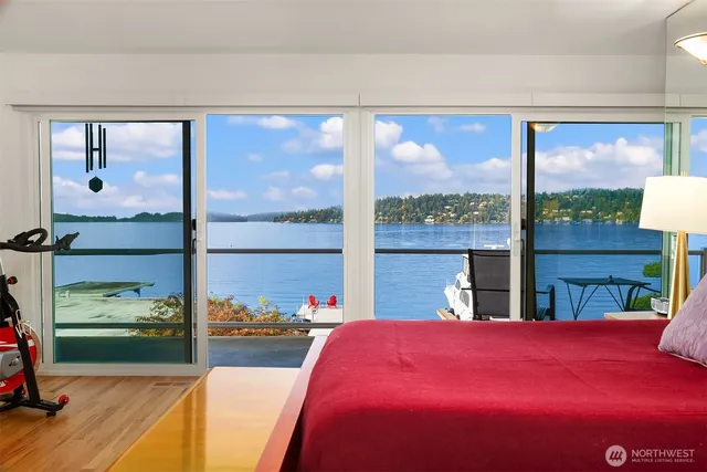 a living room filled with furniture and a floor to ceiling window