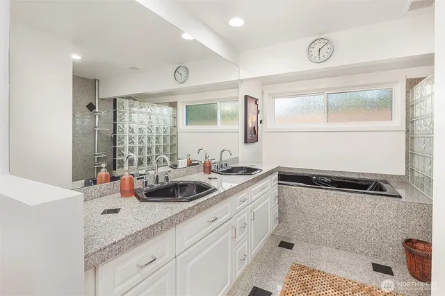 a kitchen with a sink and cabinets