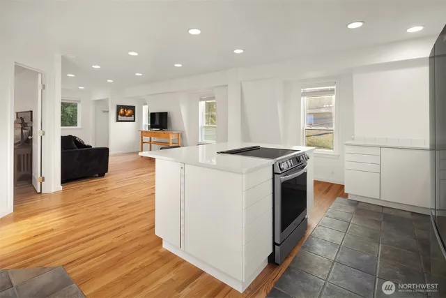 a kitchen with stainless steel appliances a refrigerator and a sink