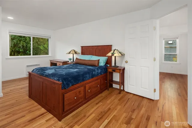 a bathroom with a shower sink and mirror