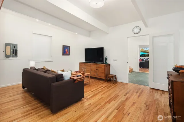 a living room with furniture and a flat screen tv