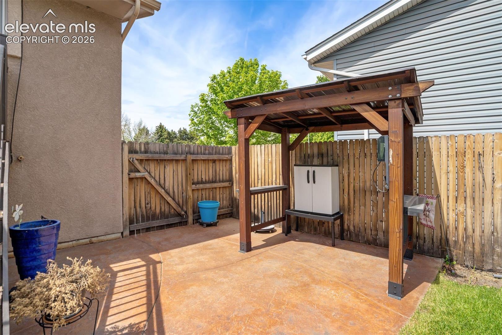 2814 Ridgeglen Place Colorado Springs, CO 80918 - Photo 39 of 50 Stamped Concrete Patio and Pergola is staying! Extra bonus!