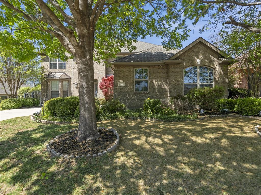 5143 Stream Crest Way Fairview, TX 75069 - Photo 2 of 35 View of front of home with brick siding, a front lawn, and a shingled roof