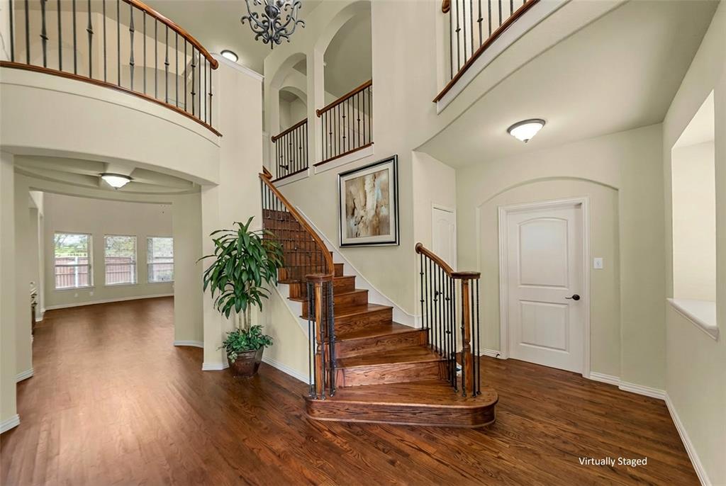 5143 Stream Crest Way Fairview, TX 75069 - Photo 4 of 35 Entrance foyer featuring a high ceiling and dark wood-style flooring