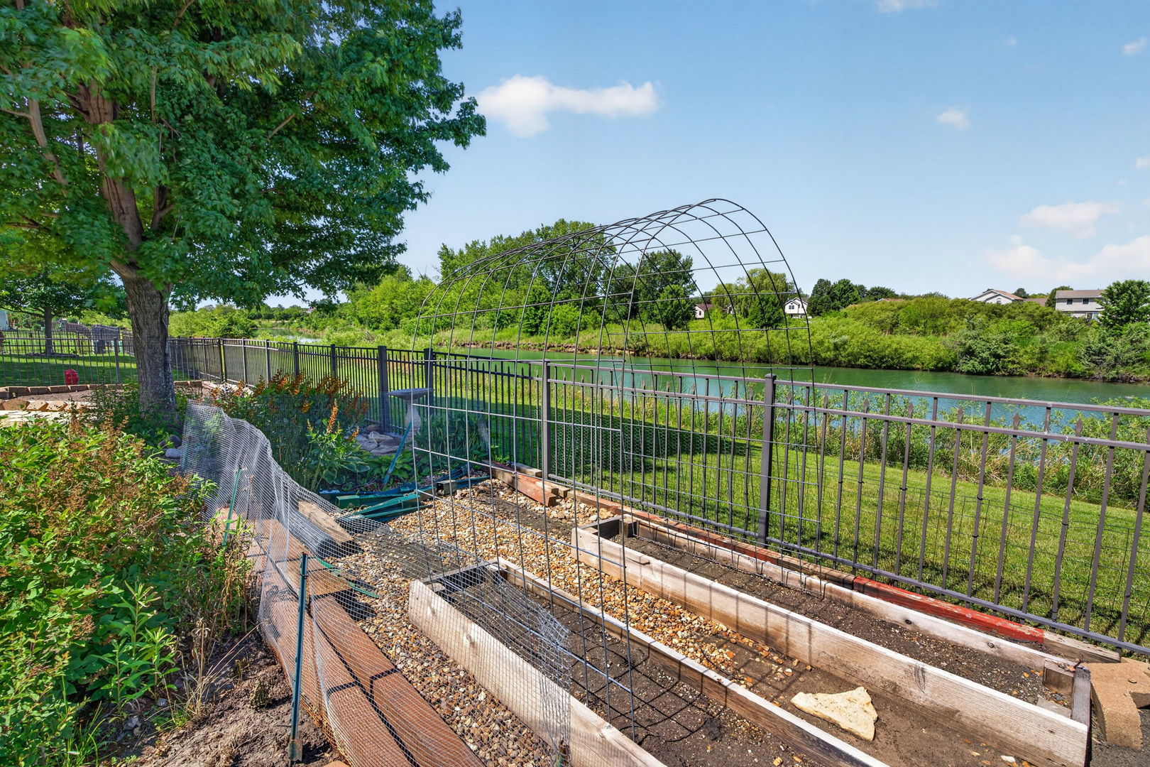 25204 Spring Street Manhattan, IL 60442 - Photo 27 of 34 a view of a lake with a deck