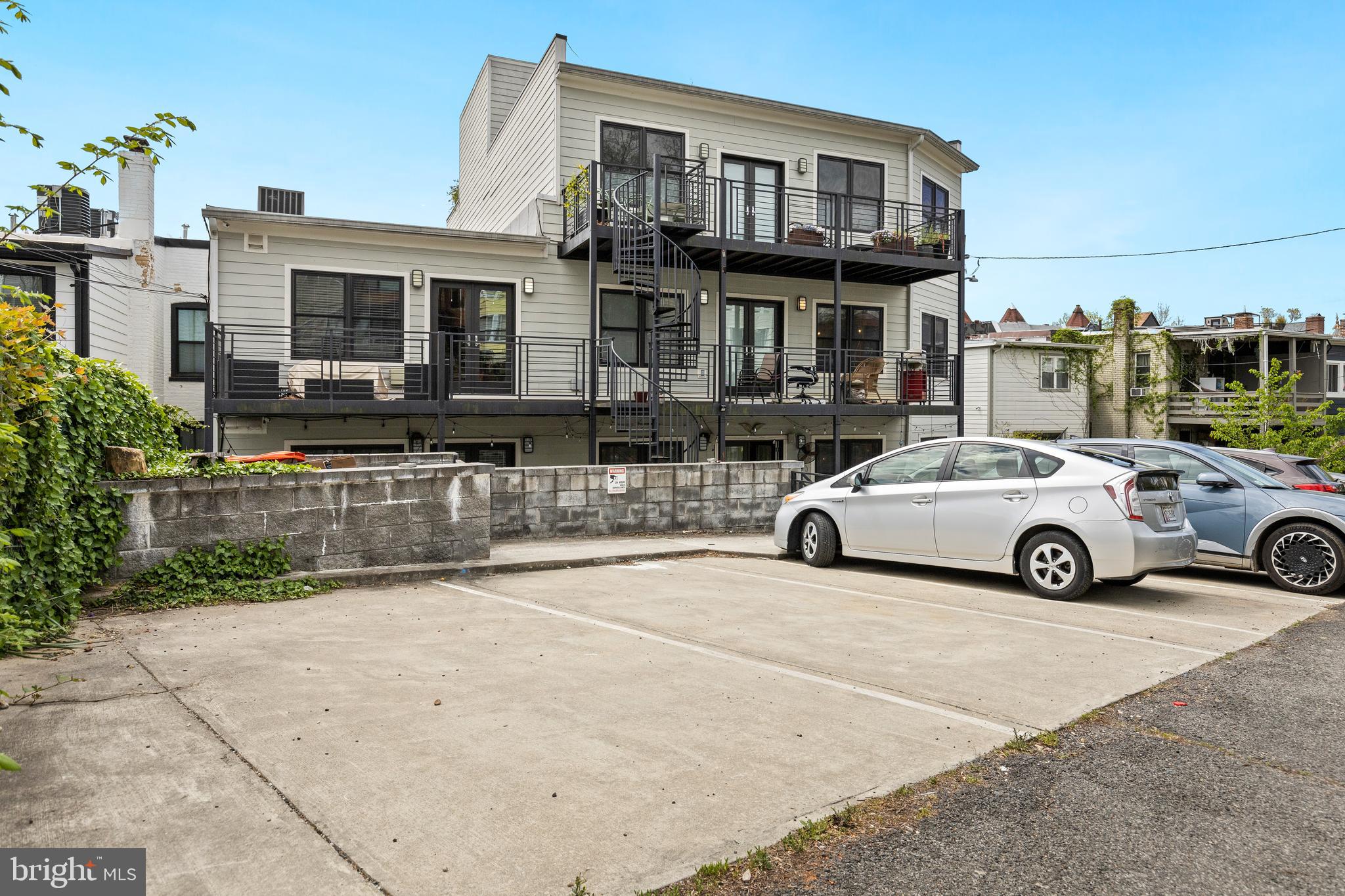 1337 Spring Road Northwest, Unit 1 Washington, DC 20010 - Photo 36 of 39 a view of a car parked in front of a building