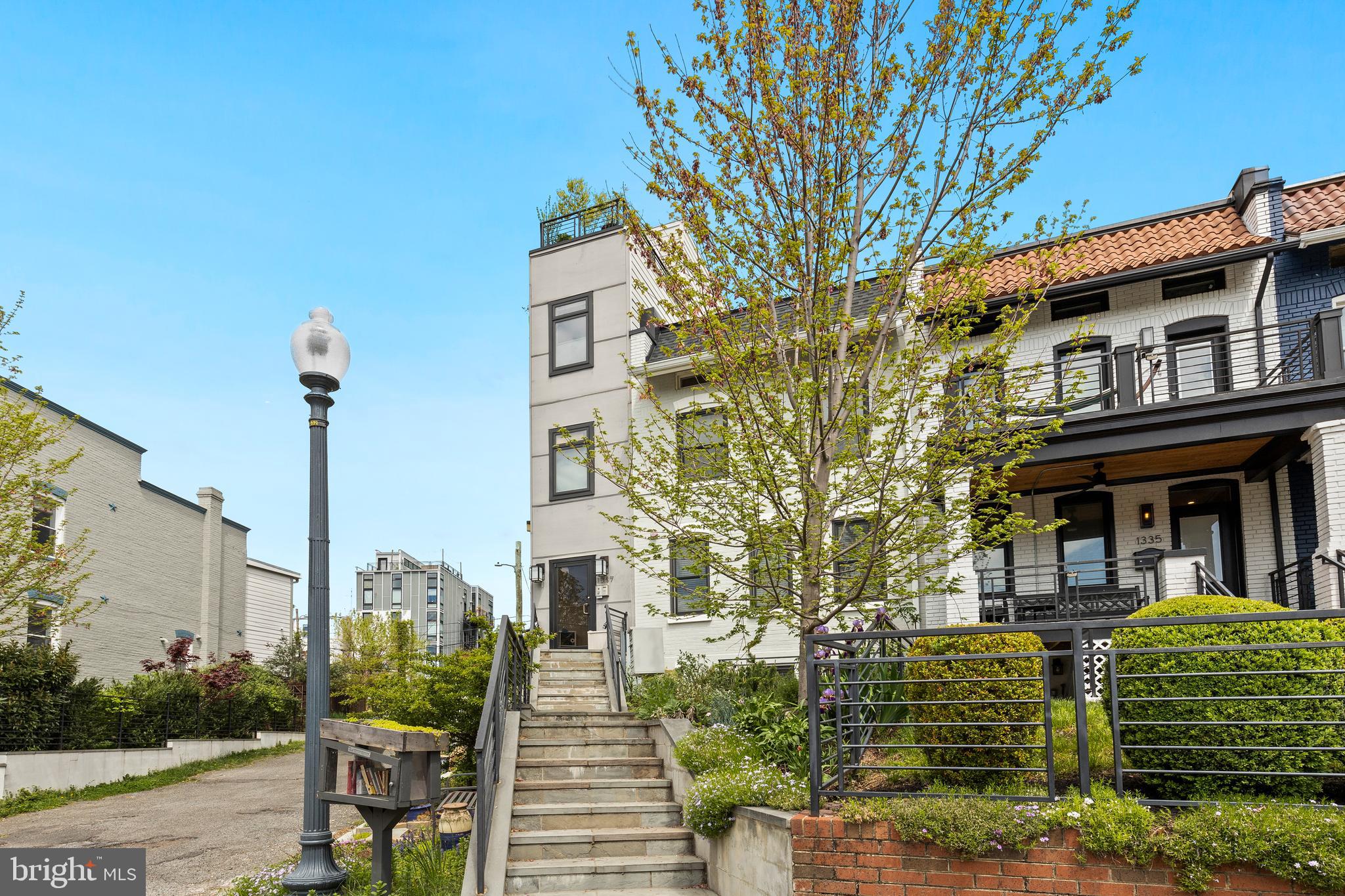 1337 Spring Road Northwest, Unit 1 Washington, DC 20010 - Photo 39 of 39 a front view of a building with garden