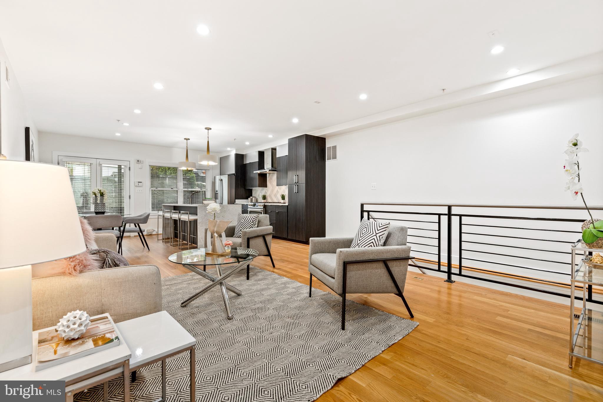 1337 Spring Road Northwest, Unit 1 Washington, DC 20010 - Photo 5 of 39 a living room with furniture and a wooden floor