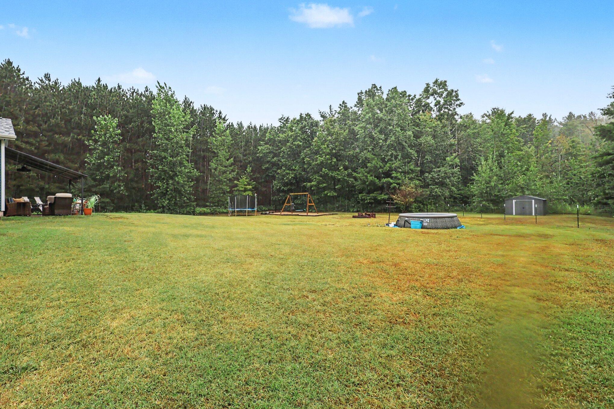 6586 Cline Road Fruitport, MI 49415 - Photo 23 of 31 Fully fenced in back yard!