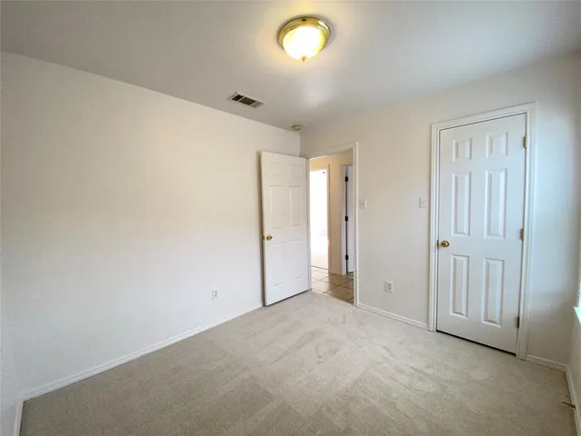 an empty room with a empty space and a window