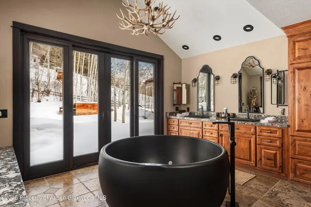 a bathroom with a sink and mirror