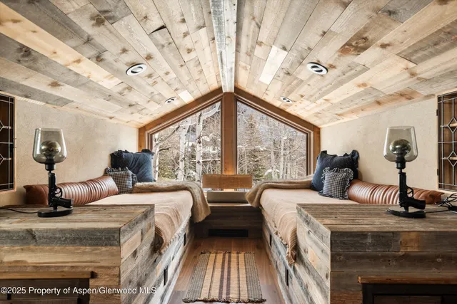 a bathroom with a granite countertop sink mirror vanity and toilet