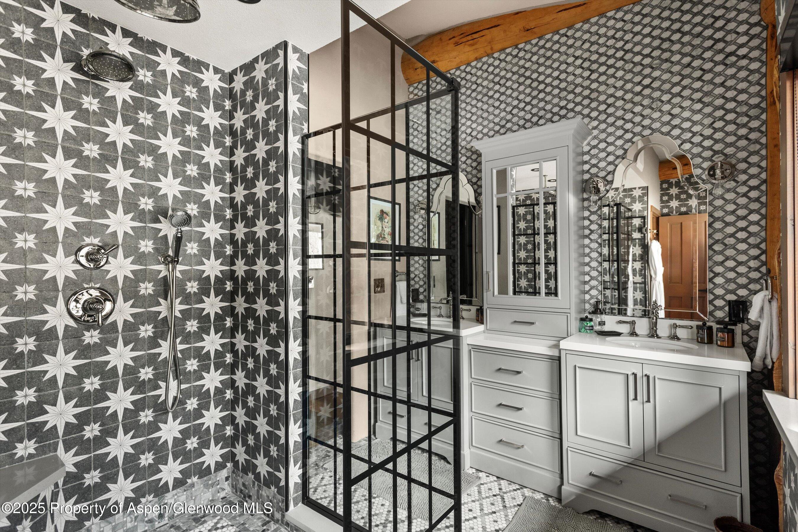 303 Conundrum Creek Road Aspen, CO 81611 - Photo 19 of 39 a bathroom with a sink and mirror