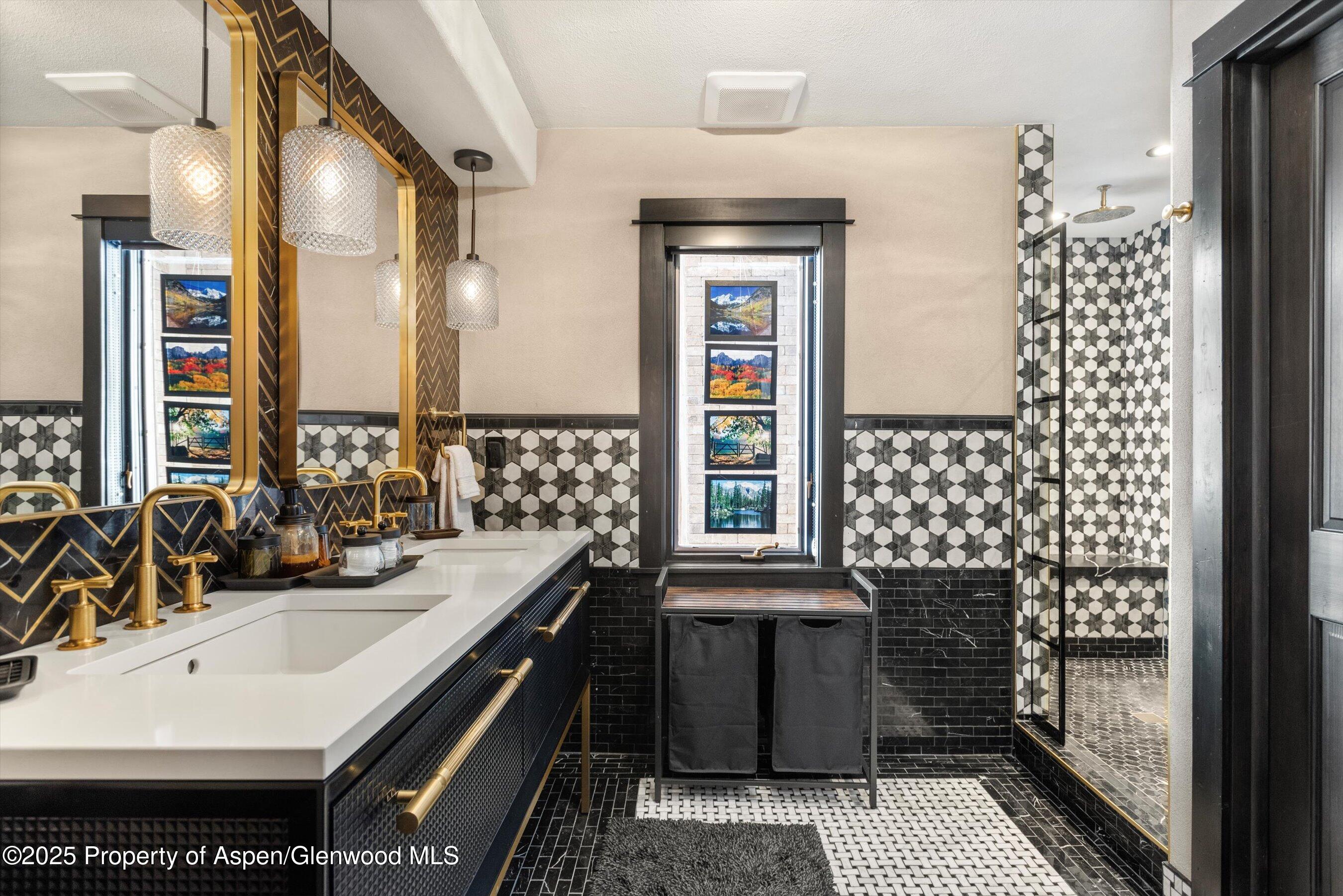 303 Conundrum Creek Road Aspen, CO 81611 - Photo 21 of 39 a bathroom with a sink and a mirror