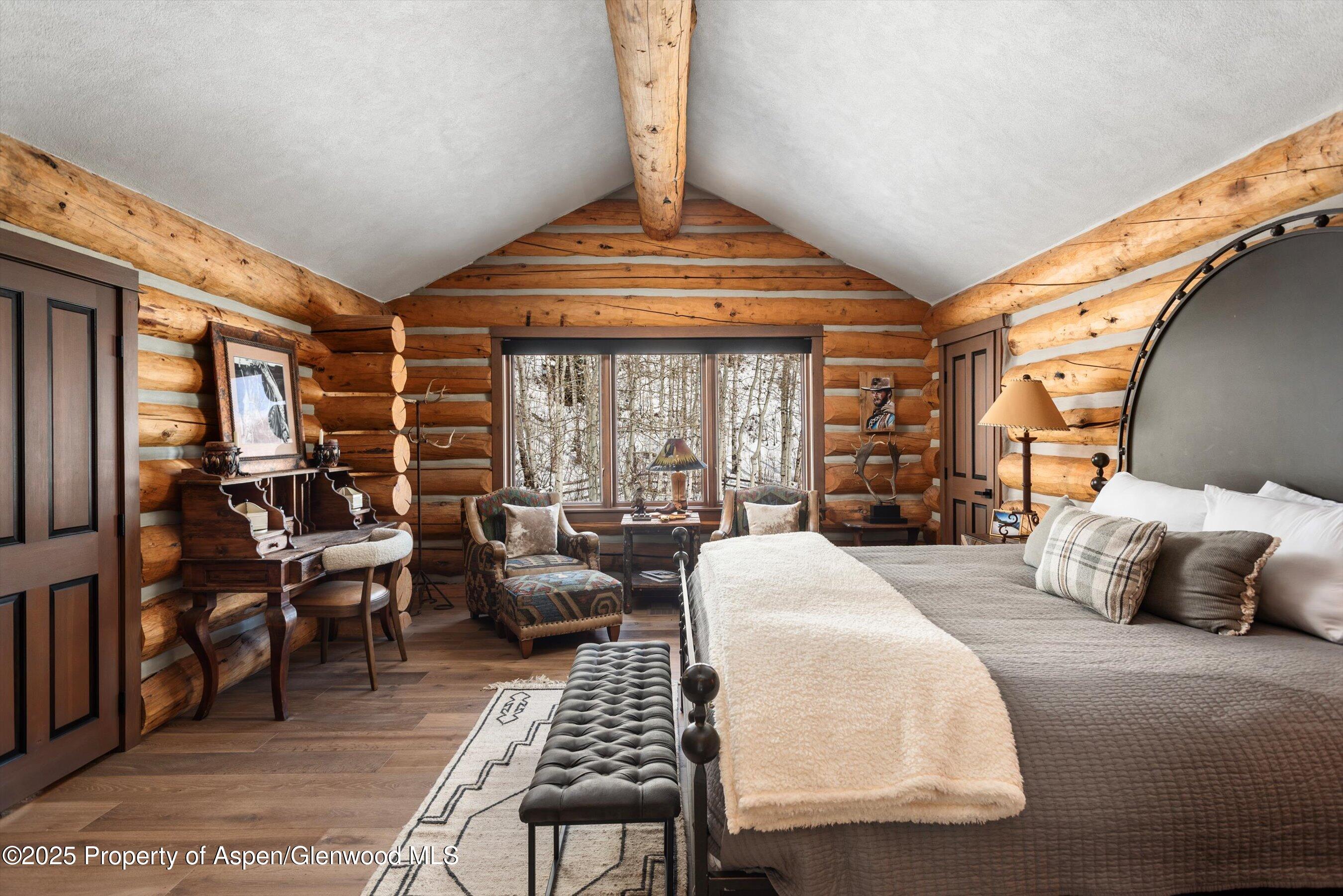 303 Conundrum Creek Road Aspen, CO 81611 - Photo 23 of 39 a living room with furniture and a chandelier