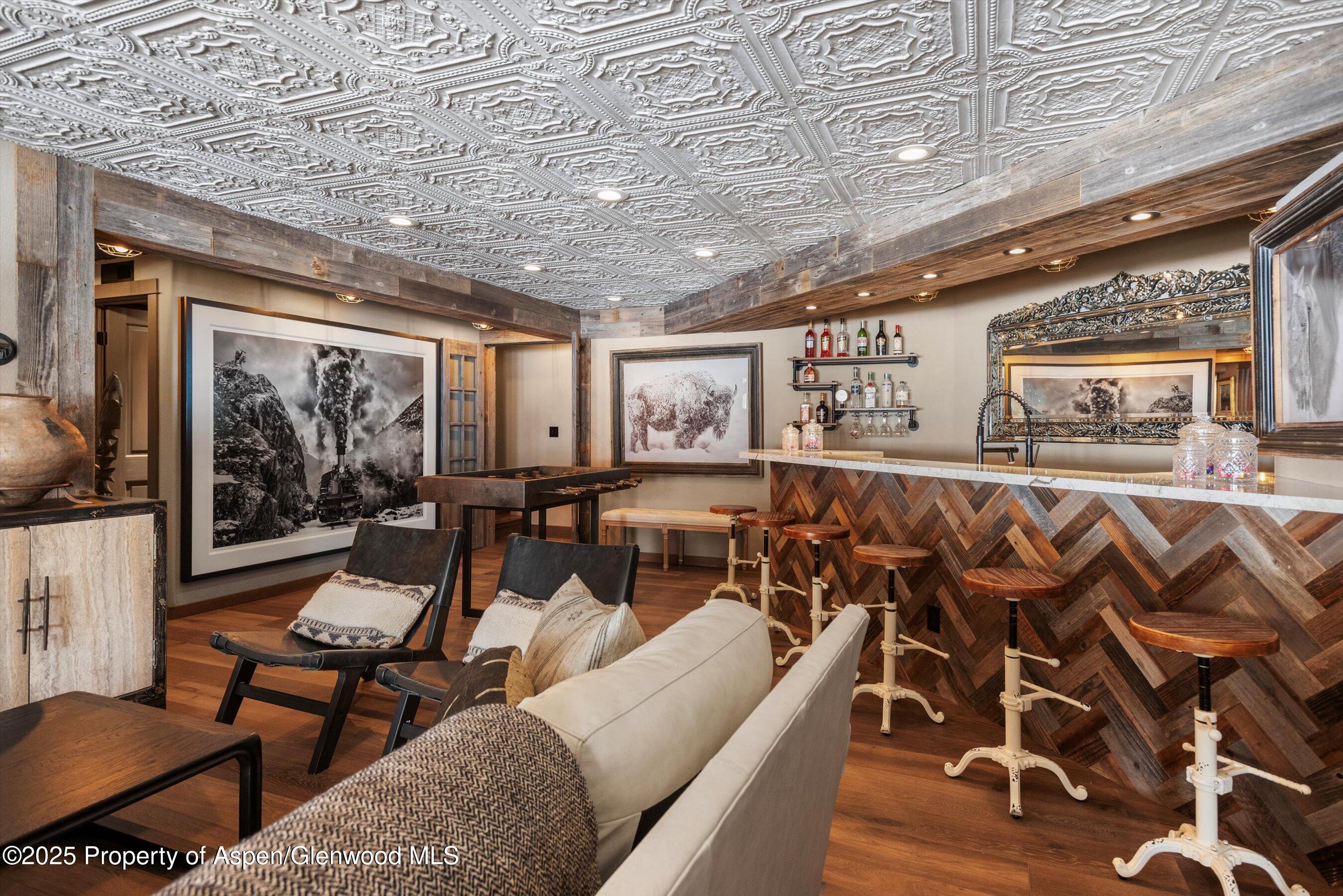 303 Conundrum Creek Road Aspen, CO 81611 - Photo 32 of 39 a living room with lots of furniture and a large window