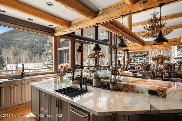 a kitchen with stainless steel appliances granite countertop a sink and counter space