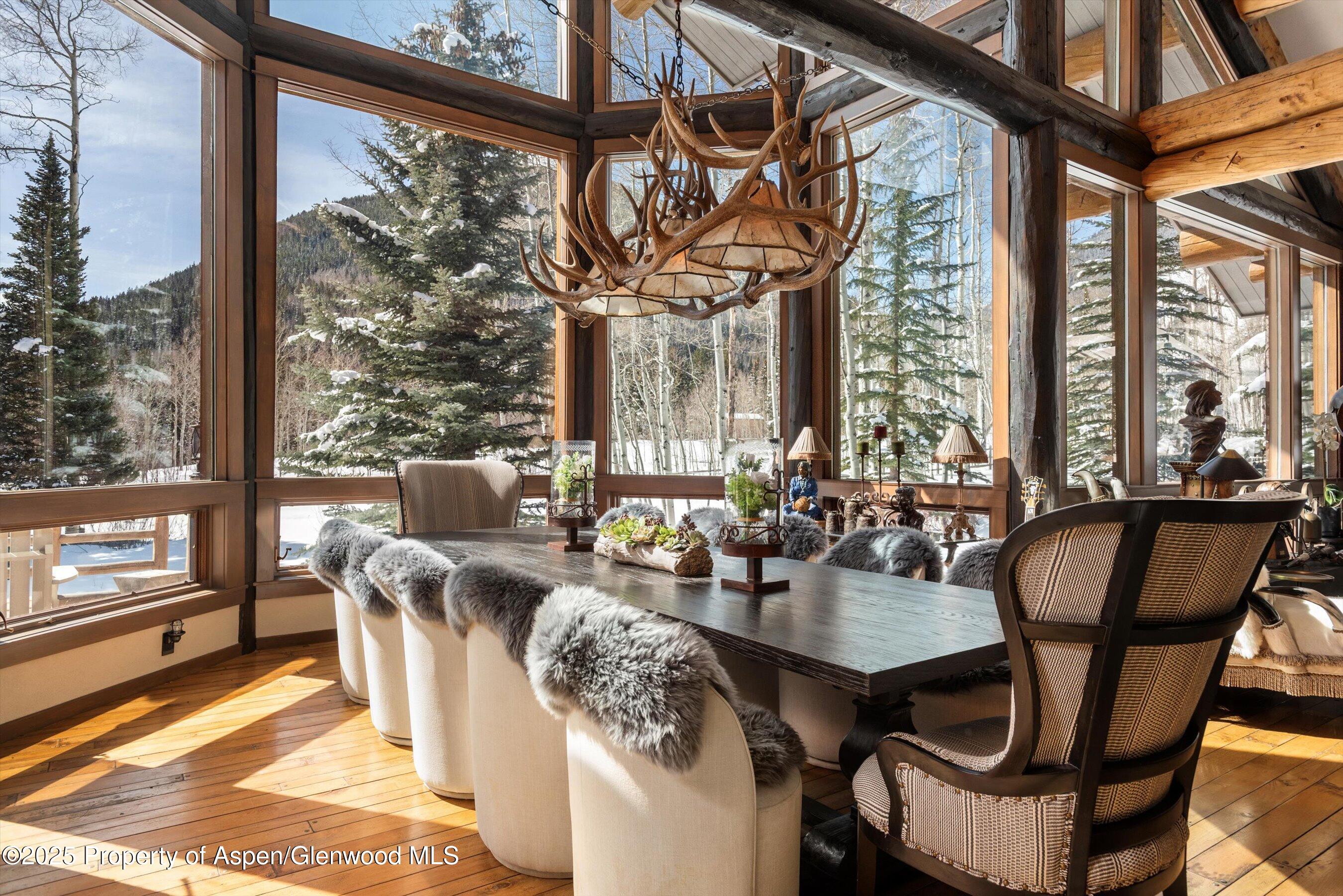 303 Conundrum Creek Road Aspen, CO 81611 - Photo 6 of 39 a view of a dining room with furniture window and outside view