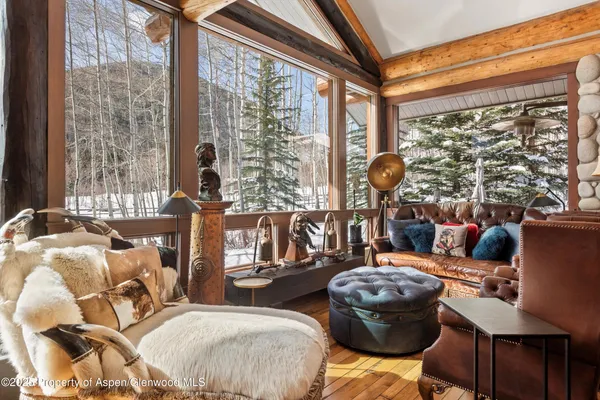 a bedroom with a large bed and a balcony