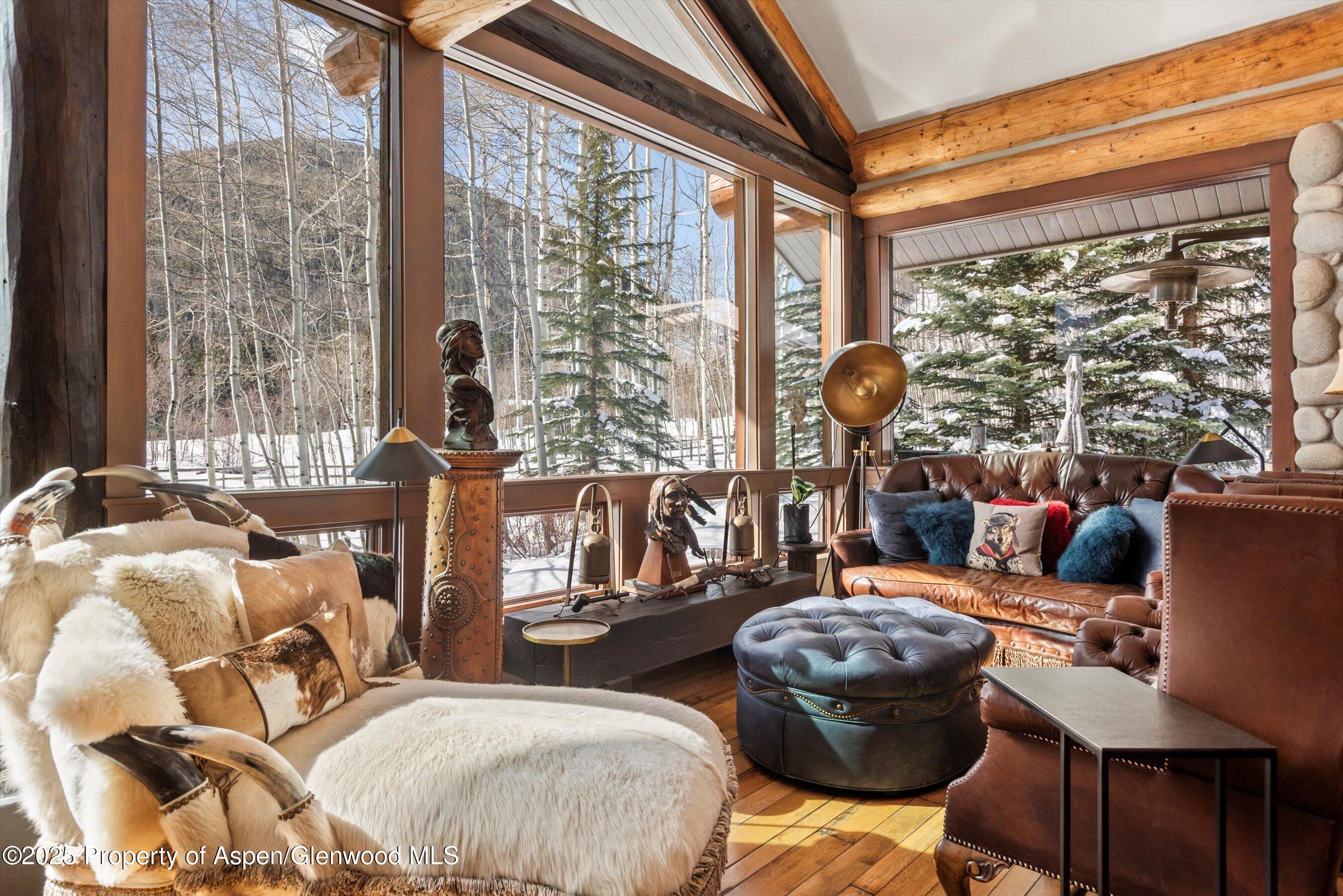 303 Conundrum Creek Road Aspen, CO 81611 - Photo 8 of 39 a bedroom with two beds and a large window