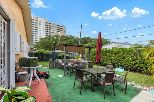 a view of yard with seating area and green space