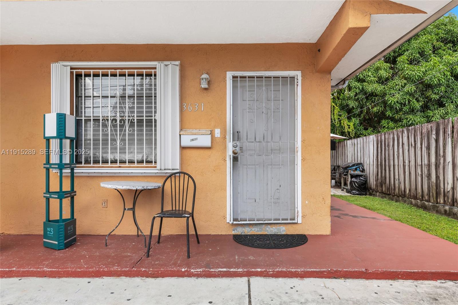 3631 Southwest 27th Street Miami, FL 33133 - Photo 5 of 24 a bench sitting in front of a building