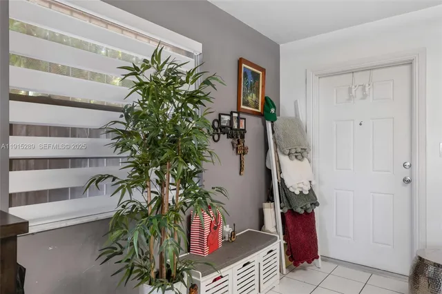 a potted plant sitting in front of a house