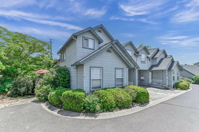 front view of a house with a small yard