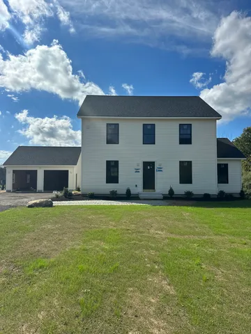 a house view with a garden space