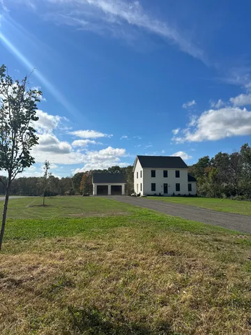 a view of a big yard with a house
