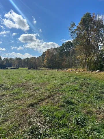 a view of a field with an outdoor space