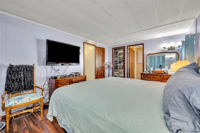 a bathroom with a granite countertop toilet sink and mirror